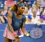 Serena Williams about to hit a tennis ball