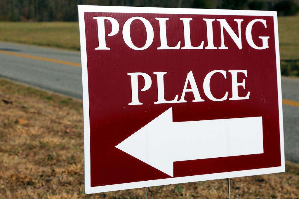 Polling Place sign pointing to the left