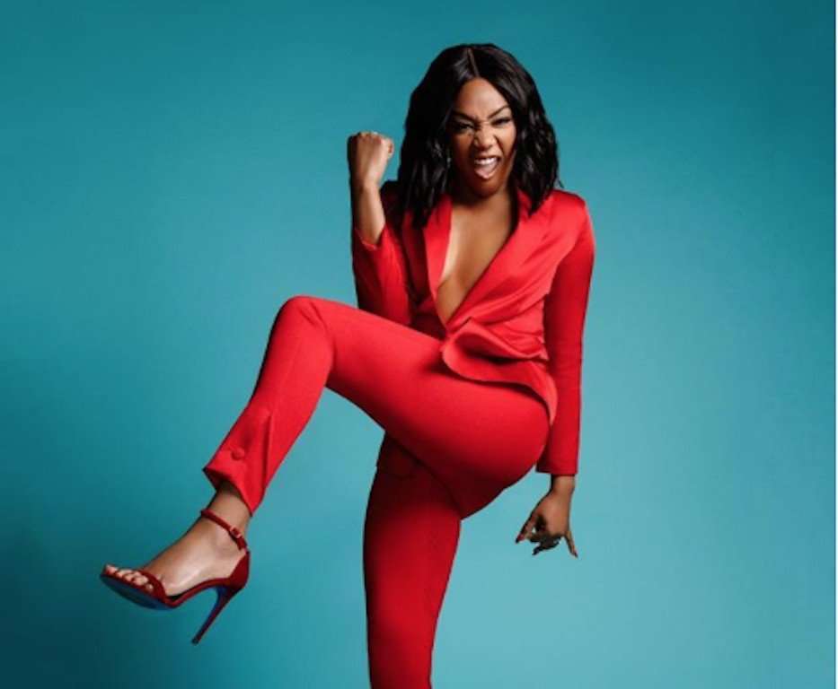 Tiffany Haddish in all red suit