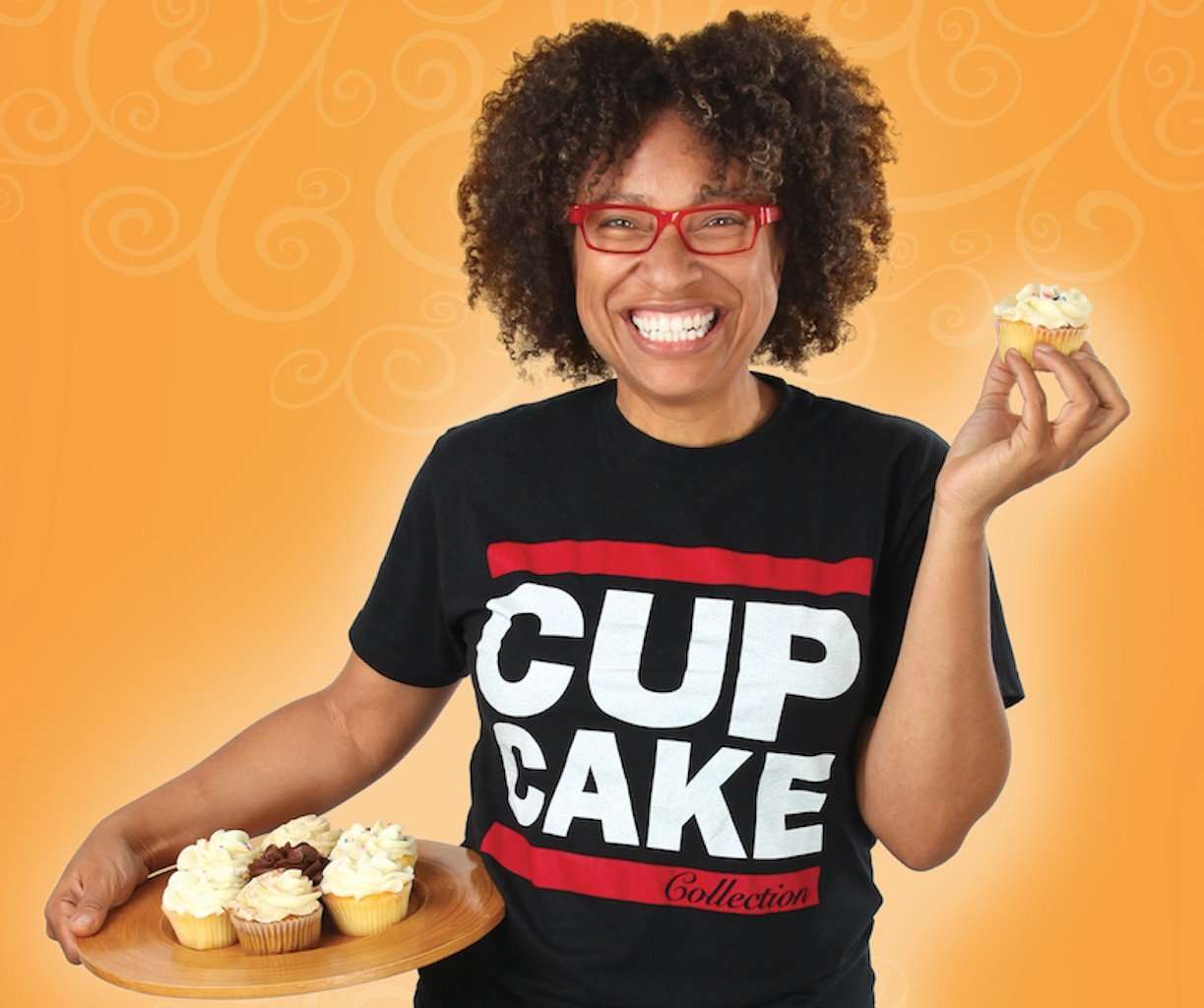 Black girl making cup cakes