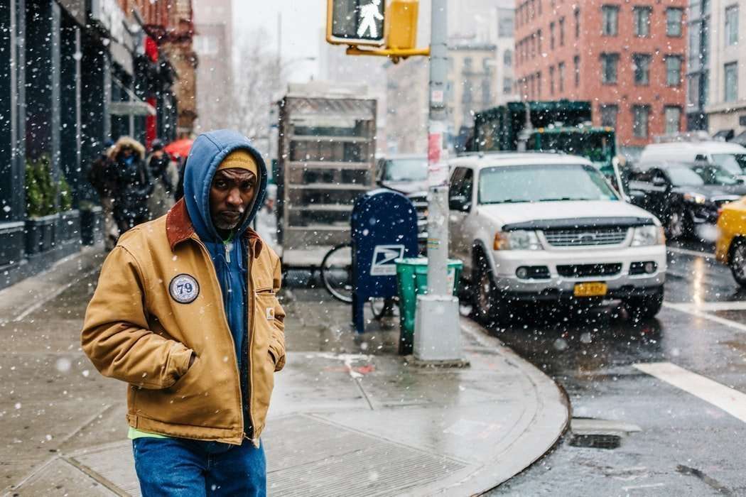 Black man on the streets in the snow