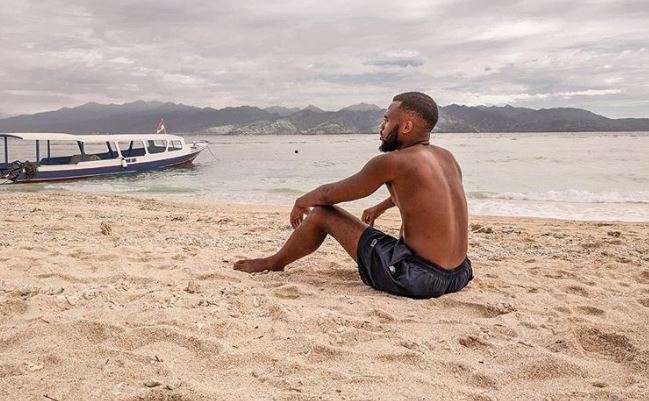Black Male traveler at a beach