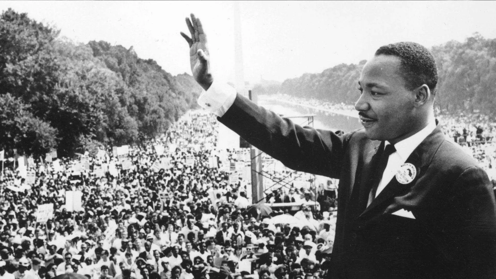 Martin Luther King holding up his hand