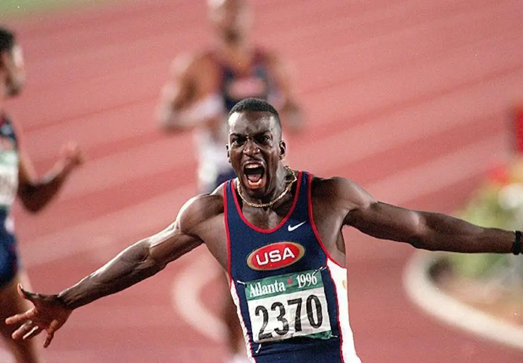 Michael Johnson after he won a race with his hands in the air