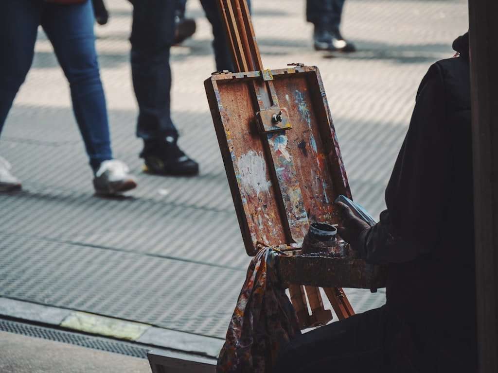 Street painter with empty canvas
