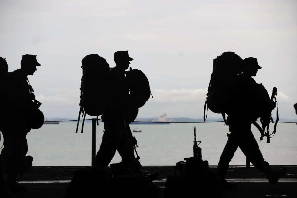 army veteran silhouette walking on a boat about to depart