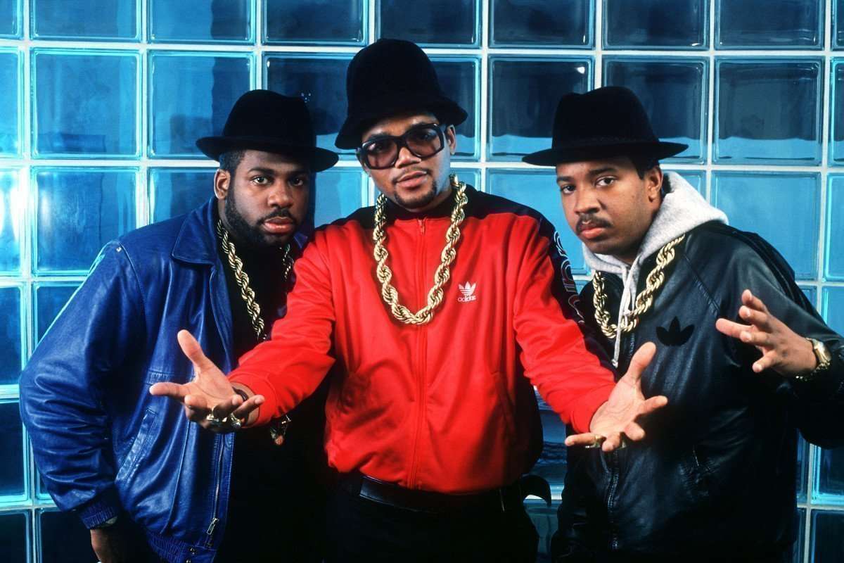 Classic photo run dmc wearing Adidas and giant gold chains