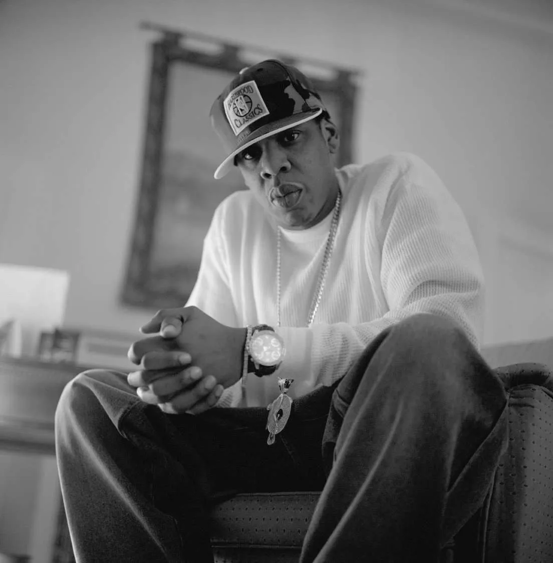 Jay Z with a roc a fella Chain and hat on