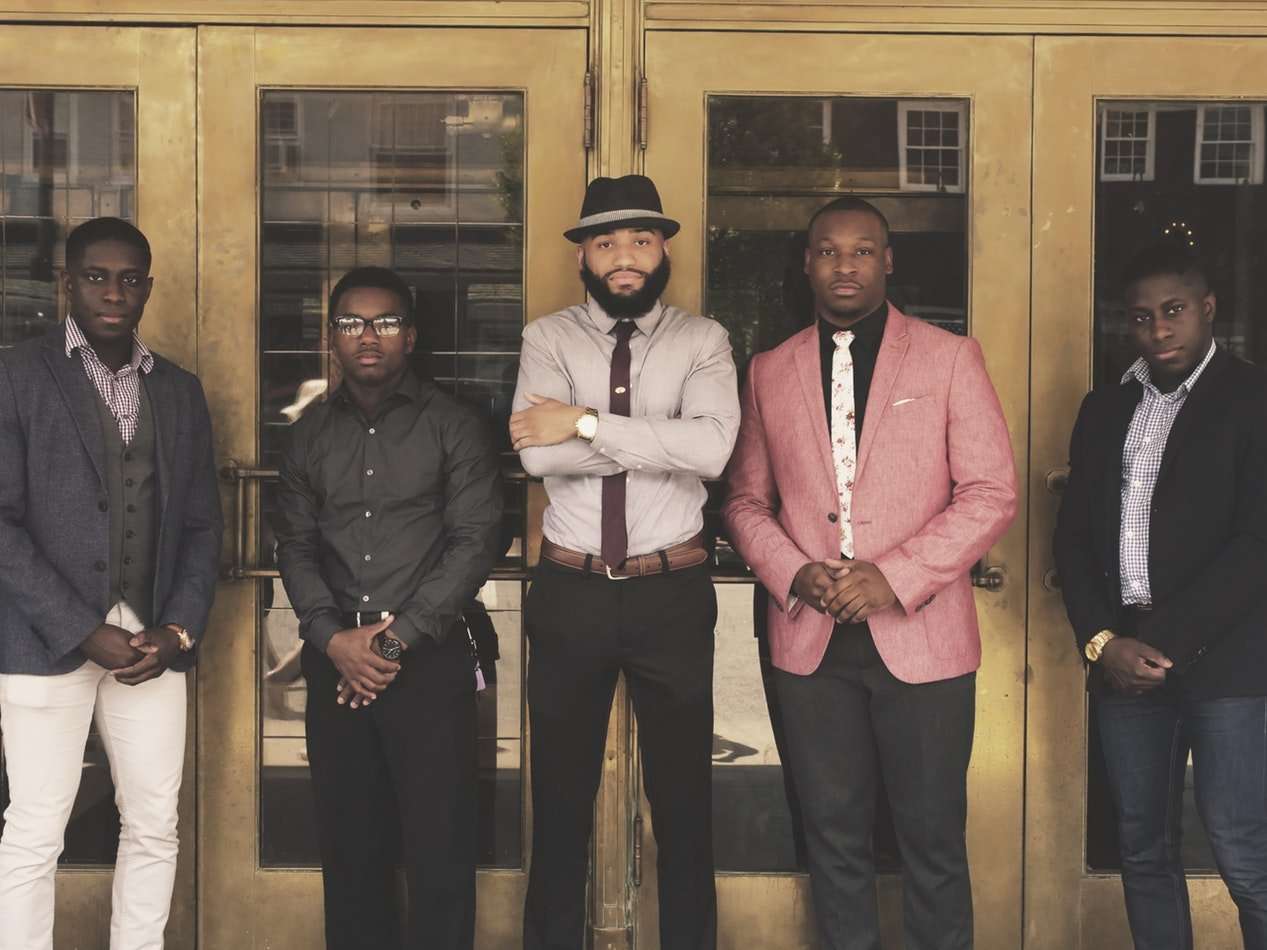 Men standing in front of a black owned bank