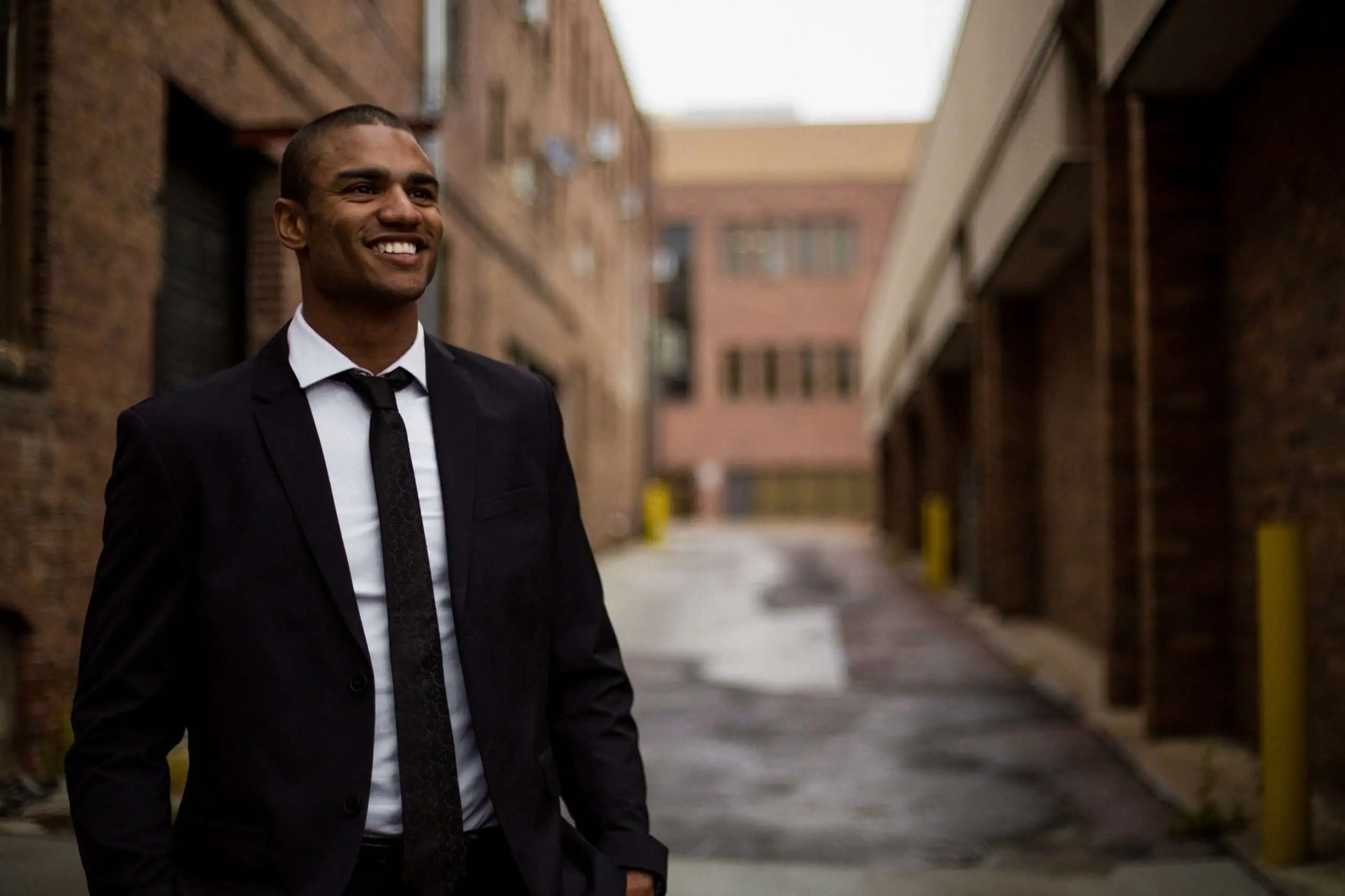 Black Man Smiling in a suit after a deal