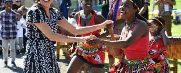 Meghan Markle and Prince Harry dancing with Ubuntu African Dancers
