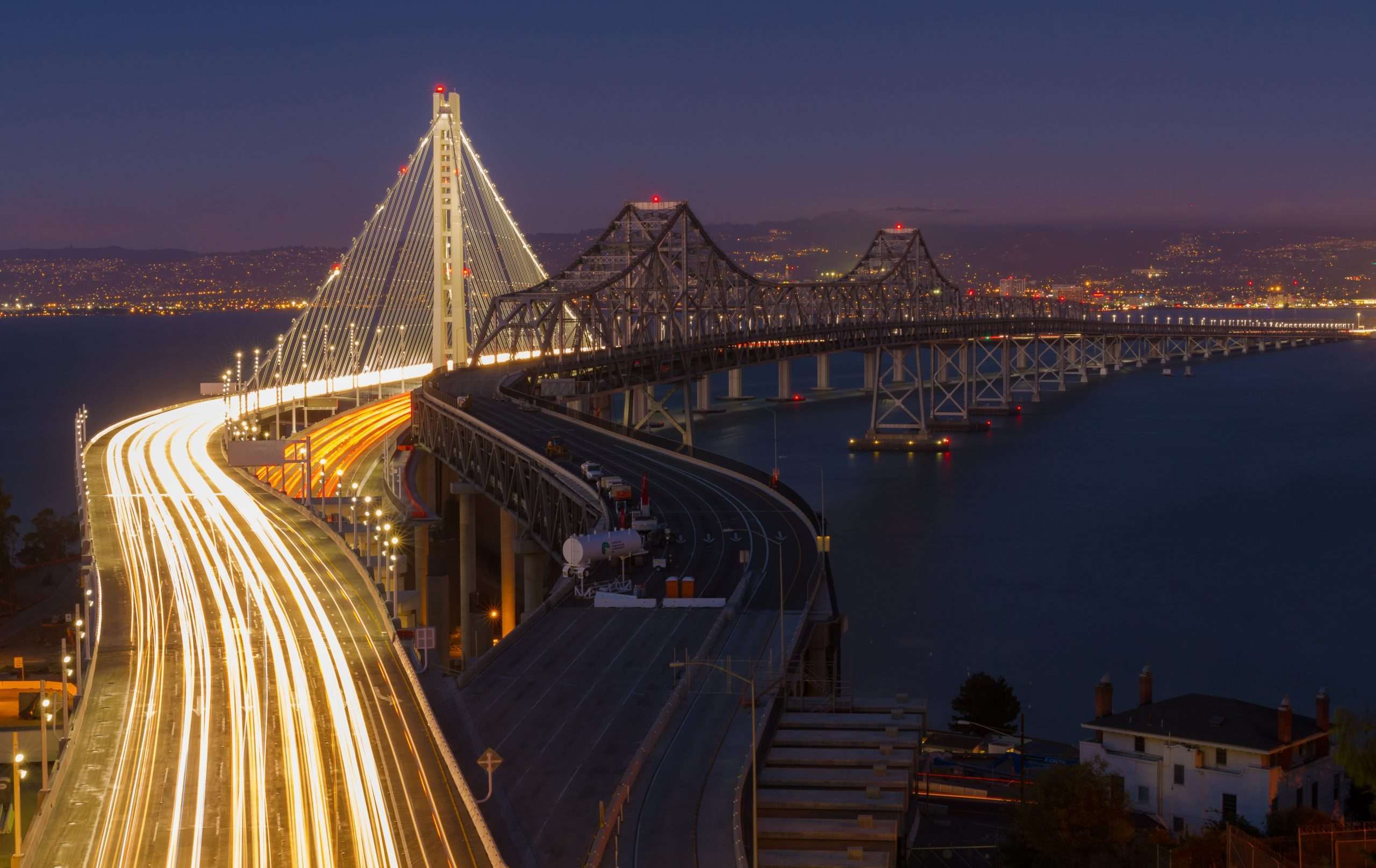 Pictures of cars going fast on golden state bridge in San Francisco, California