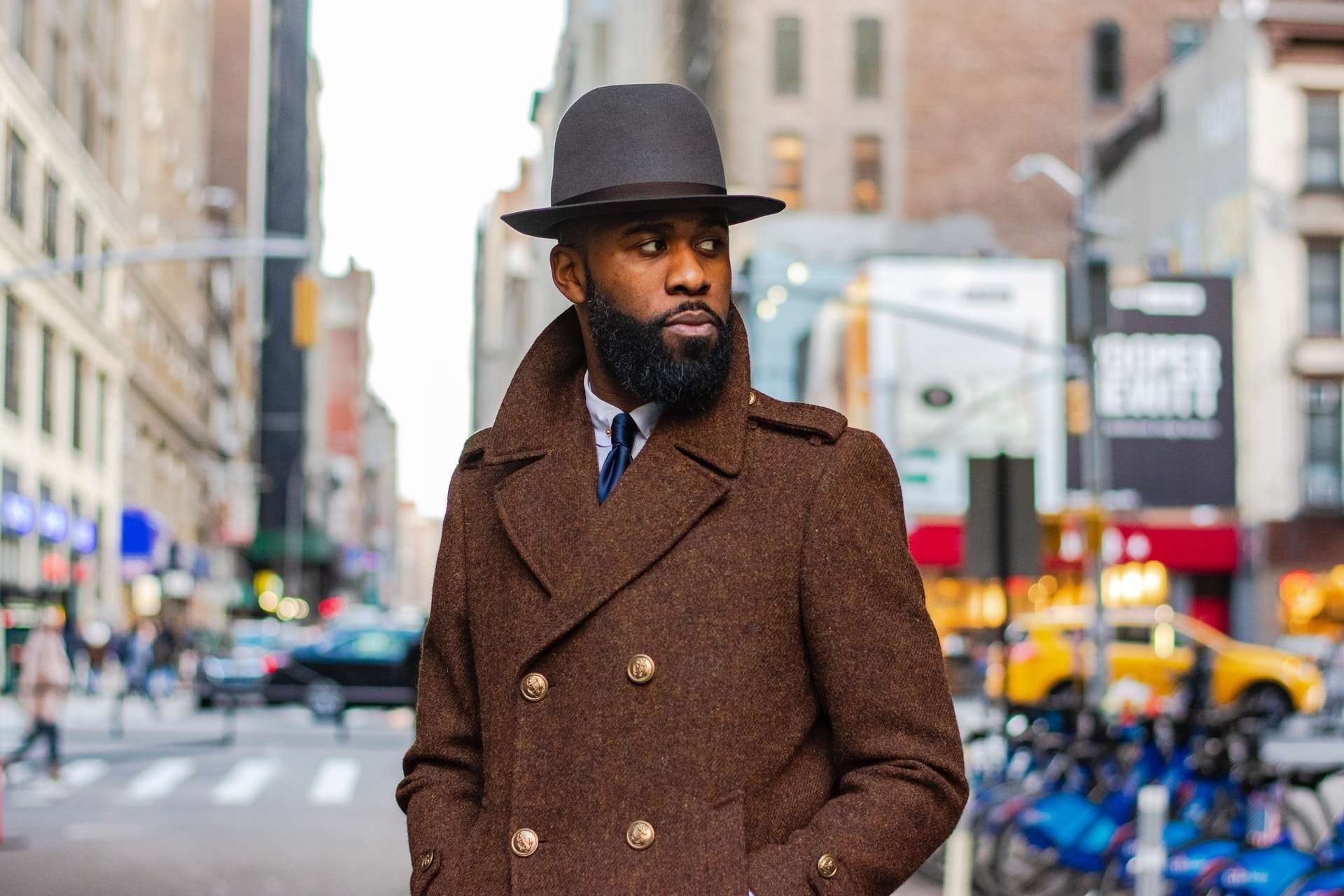 Black Man in a Brown Coat with beard and top hat