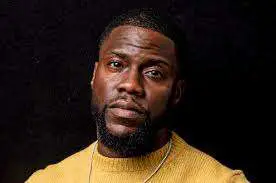 Kevin Hart serious face in yellow sweater