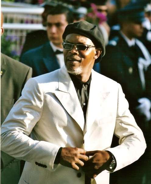 Samuel Jackson on the runway in a white suit