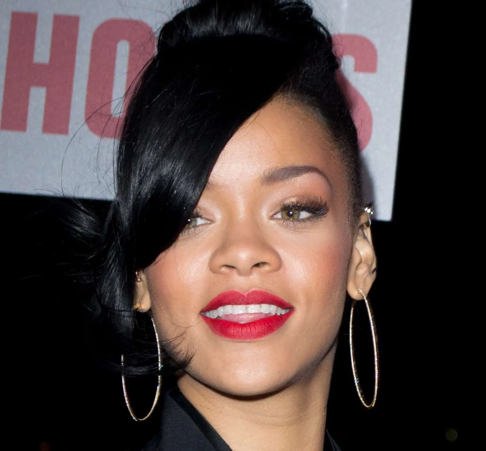 rihanna smiling with red lip stick