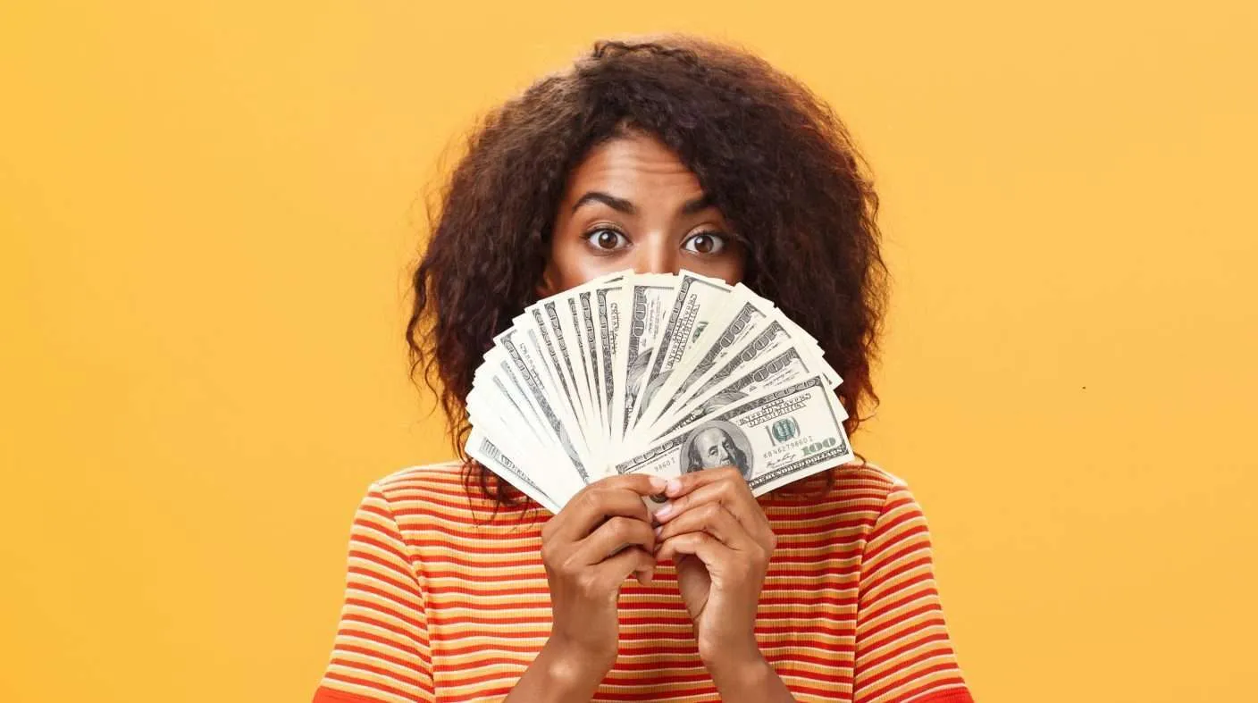 Black women with money in her hand