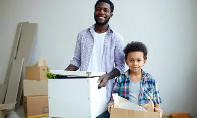 Black man and his son moving