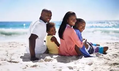 Black family by the beach