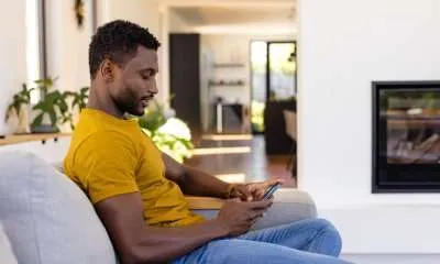 black man using smart phone