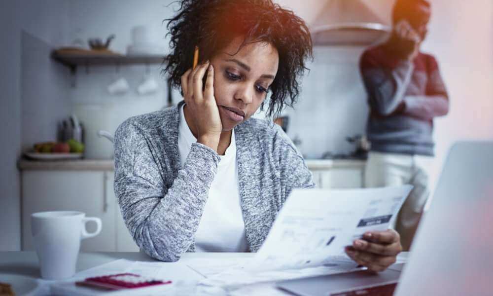 Black couple reviewing bank of america documents