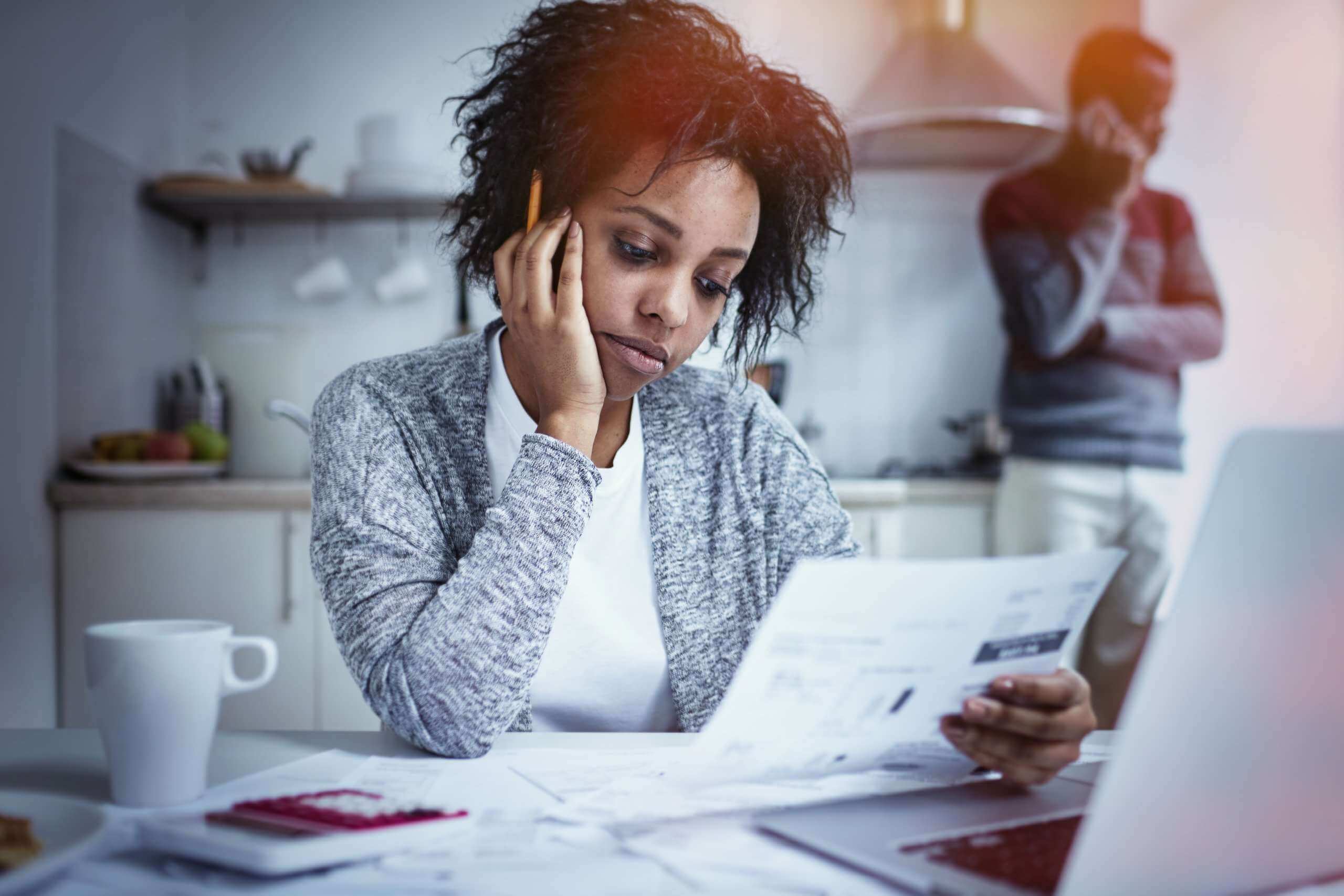 Black couple reviewing bank of america documents