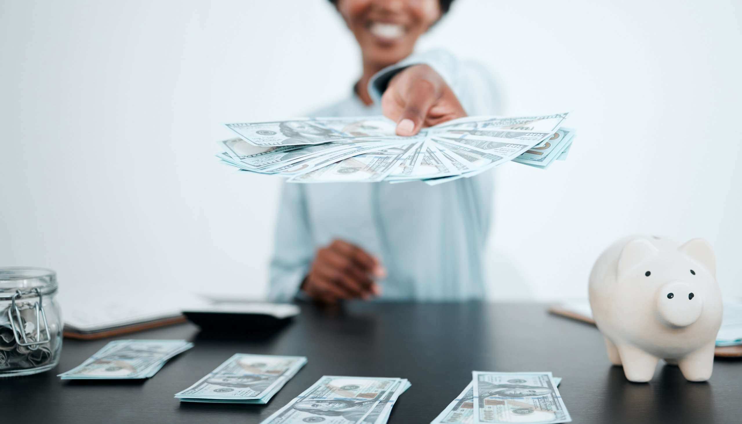 black woman with a lot of money