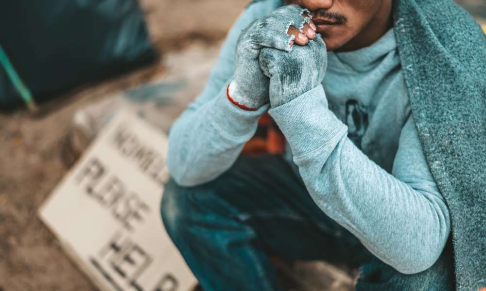 black homeless man begging