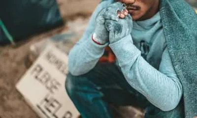black homeless man begging